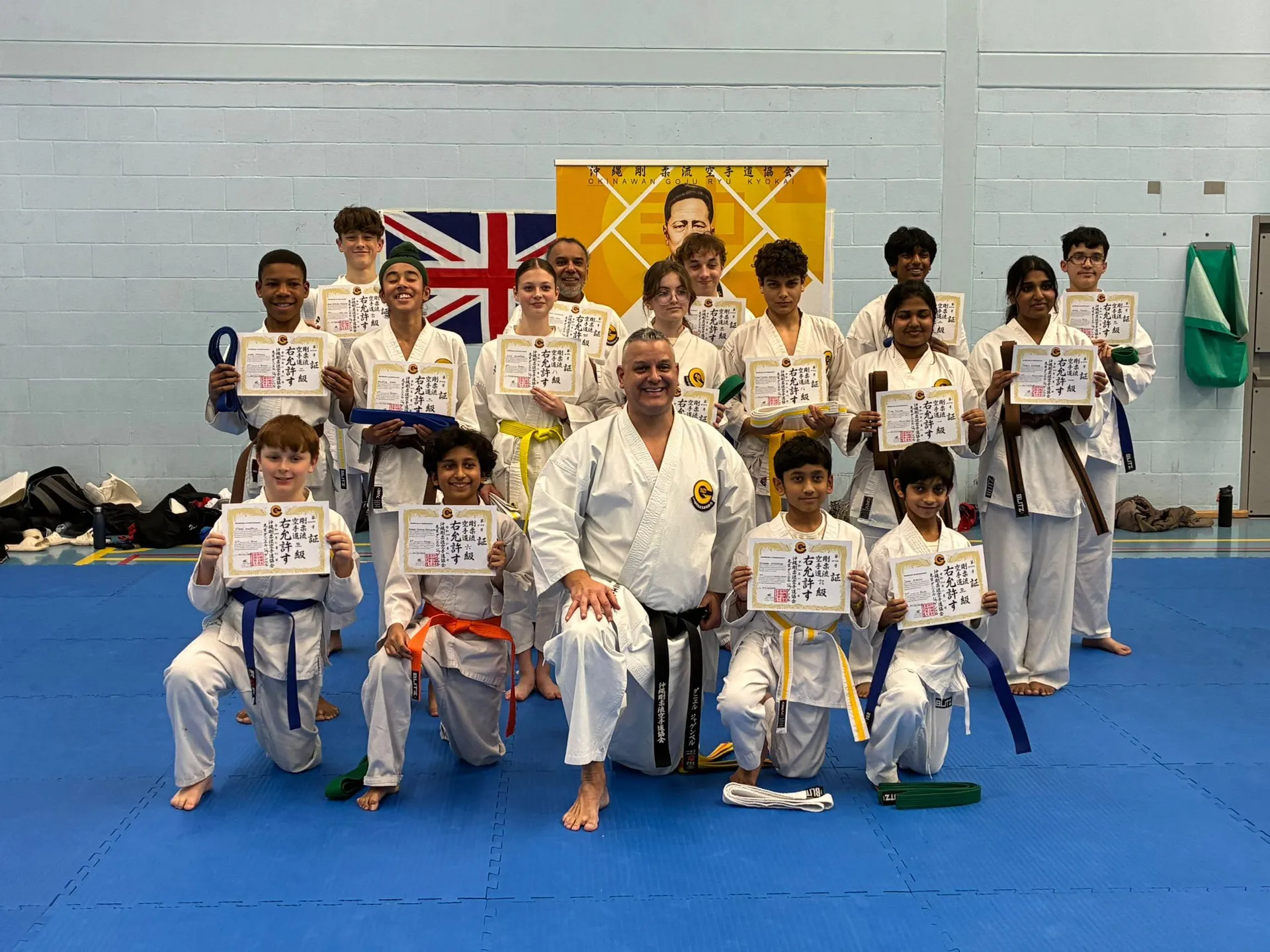 Students receiving grading certificates alongside Sensei Daniel Jagemberg