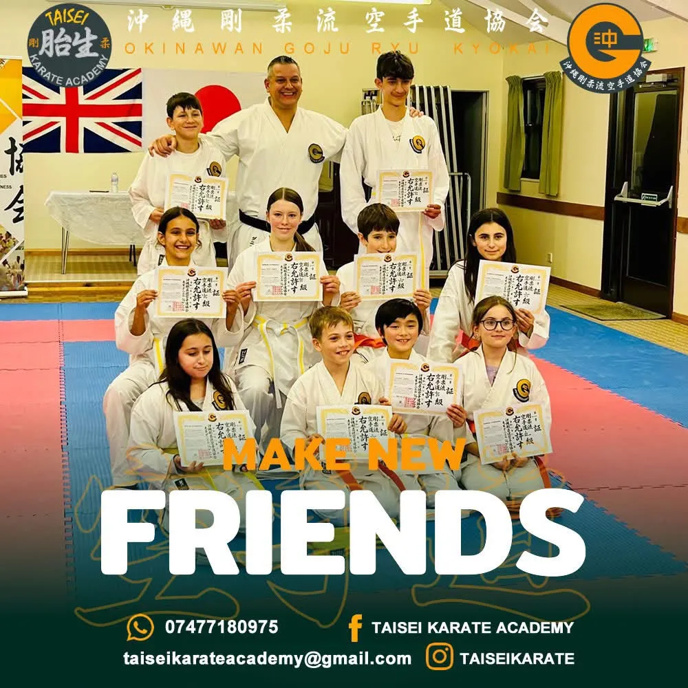 Sensei Daniel Jagemberg with students holding their grading certificates